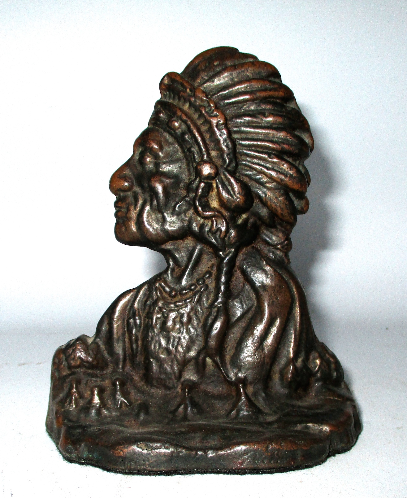 One of a Pair of Cast Iron Indian Chief Bookends w/Copper Highlights