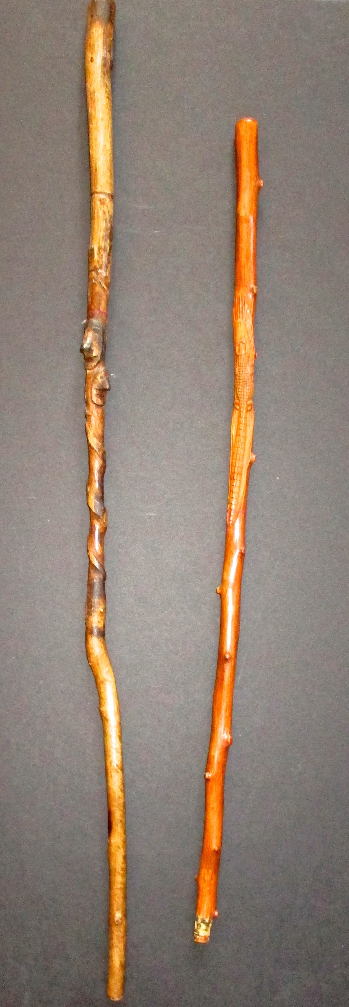 Walking Stick w/Hand-carved Heads (L) and Walking Stick w/Hand-carved Alligator (R)