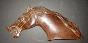 Cast Iron C. W. Parker Carousel Horse Head (The CI Horse was a prototype version that wasn't put into production because the weight made it impractical ) (24" L x 12" H x 5" D)